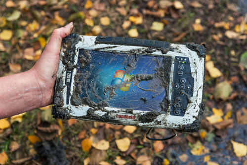 algiz 7 rugged tablet handheld outdoors in mud ip65